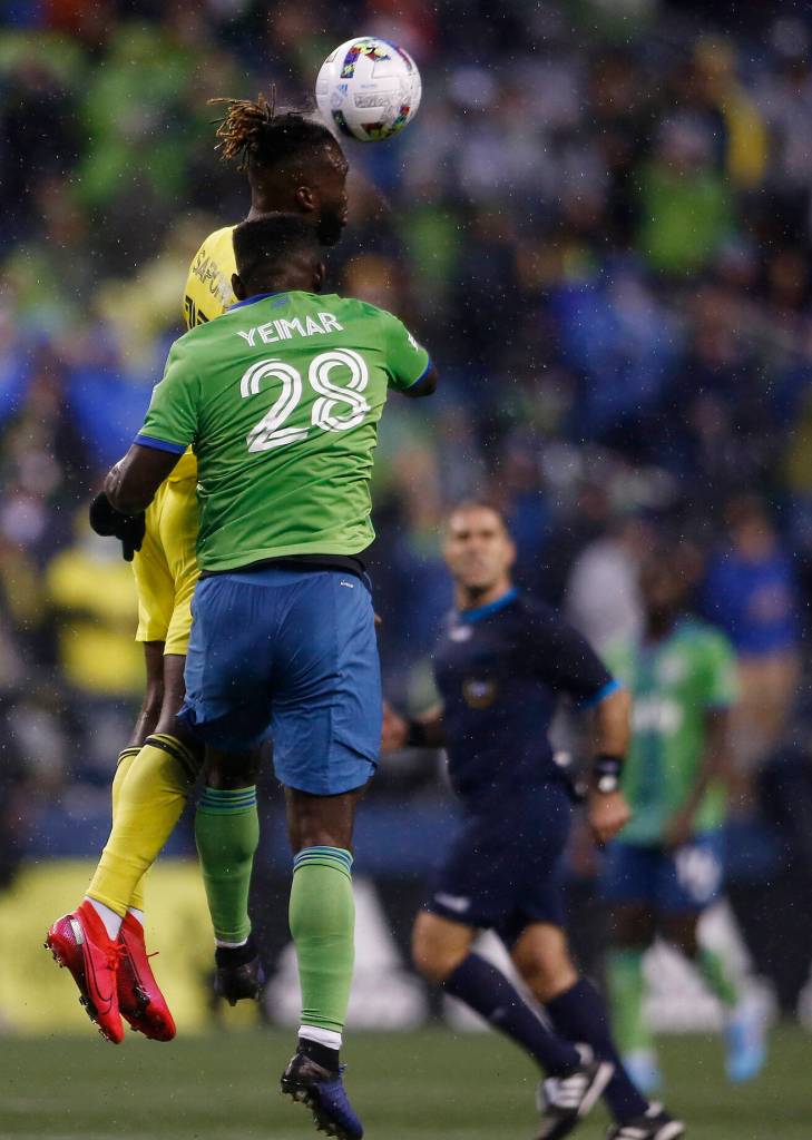 The Seattle Sounders Yeimar goes up for a header during the opening game of the 2022 season against Nashville SC on Sunday, Feb. 27, 2022, at Lumen Field in Seattle, Washington. (Ryan Berry / The Herald)