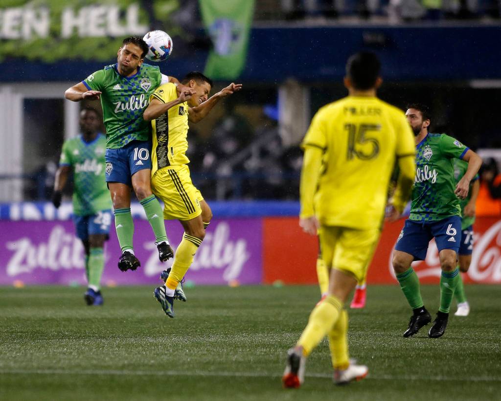 The Seattle Sounders Nicolas Lodeiro goes for the header during the opening game of the 2022 season against Nashville SC on Sunday, Feb. 27, 2022, at Lumen Field in Seattle, Washington. (Ryan Berry / The Herald)