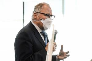 Gov. Jay Inslee speaks to students at Gonzaga University in Spokane, Wash. on Friday, Feb. 18, 2022. (Kathy Plonka/The Spokesman-Review via AP)