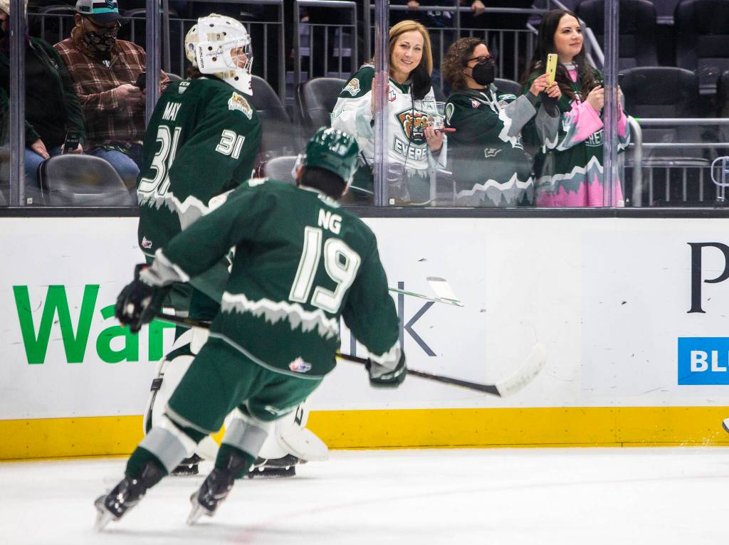 Everett Silvertips fans watch the team warmup before the start of the game against the Seattle Thunderbirds at Climate Pledge Arena on Saturday, Feb. 26, 2022 in Seattle, Washington. (Olivia Vanni / The Herald)