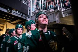 Everett Silvertips’ Dylan Anderson looks out of the tunnel into Climate Pledge Arena before the team skates onto the ice for the game against the Seattle Thunderbirds on Saturday, Feb. 26, 2022 in Seattle, Washington. (Olivia Vanni / The Herald)