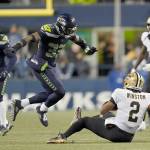 New Orleans Saints quarterback Jameis Winston (2) goes down in front of Seattle Seahawks safety Jamal Adams (33) during a game Oct. 25, 2021, in Seattle. (AP Photo/Ted S. Warren)