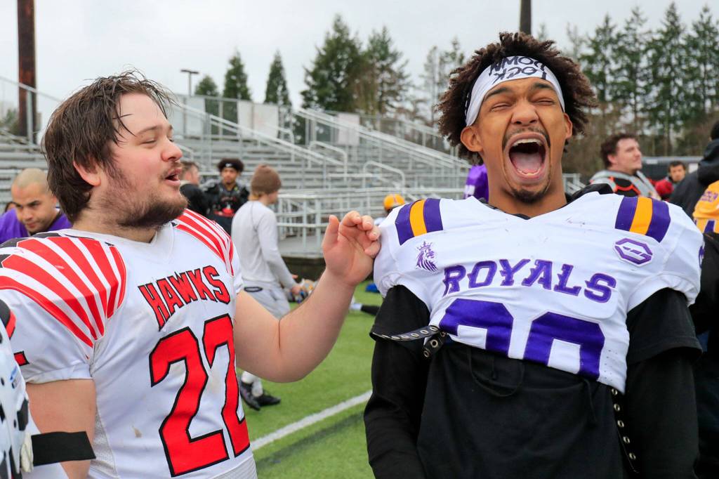 Brad Peth (left) and Marcus Goodman share a laugh during practice at Archbishop Murphy High School in Everett. (Kevin Clark / The Herald)