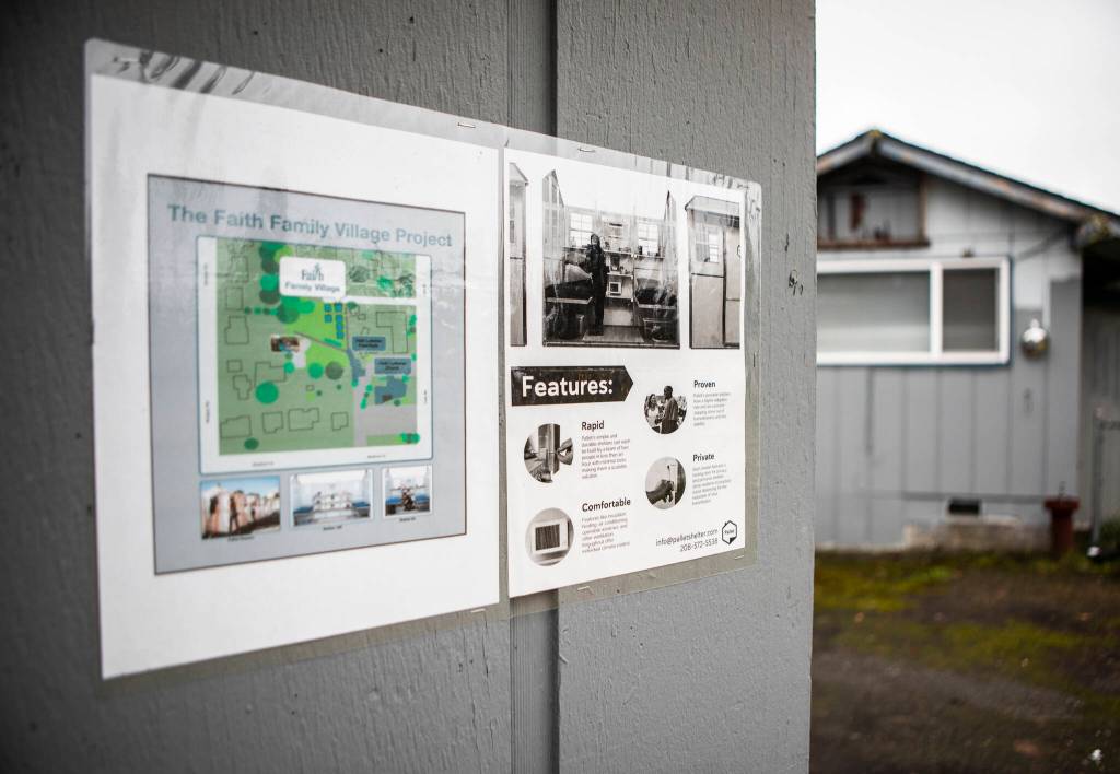 An outline of the project is posted on one of the buildings Tuesday in Everett. (Olivia Vanni / The Herald)