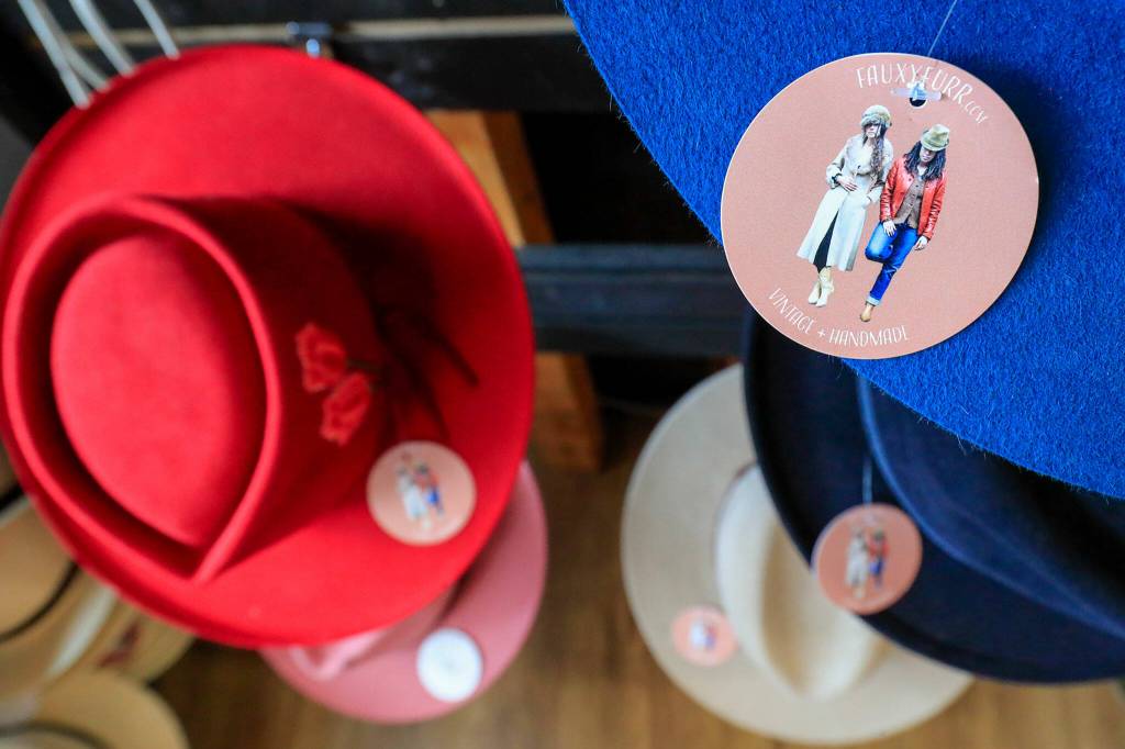 Finished hats await customers at FauxyFurr in Arlington. (Kevin Clark / The Herald)
