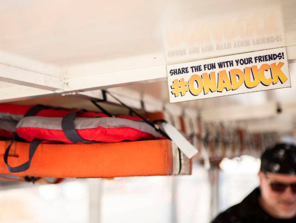 Signs from the Duck tours visible inside the vehicle in Mukilteo. (Olivia Vanni / The Herald)