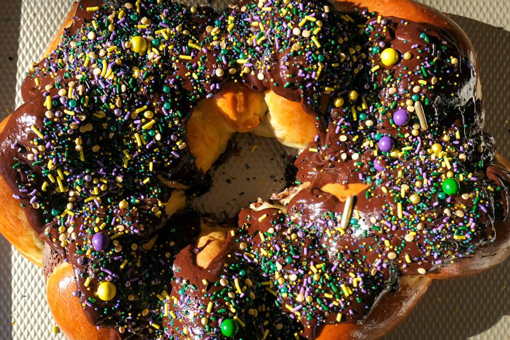 The finished cake is topped with green, purple and gold sprinkles. (Taylor Goebel / The Herald)