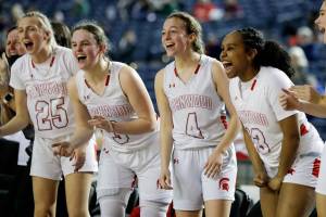 Stanwood's bench the action of the floor against Auburn Wednesday evening in Tacoma, Washington on March 2, 2022. The Spartans advance with their 53-39- victory over the Trojans. (Kevin Clark / The Herald)