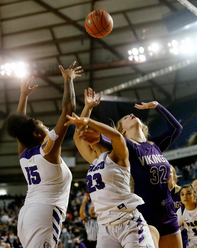 Lake Stevens Cori Wilcox scores down low against Pasco on Thursday at the Tacoma Dome. (Ryan Berry / The Herald)
