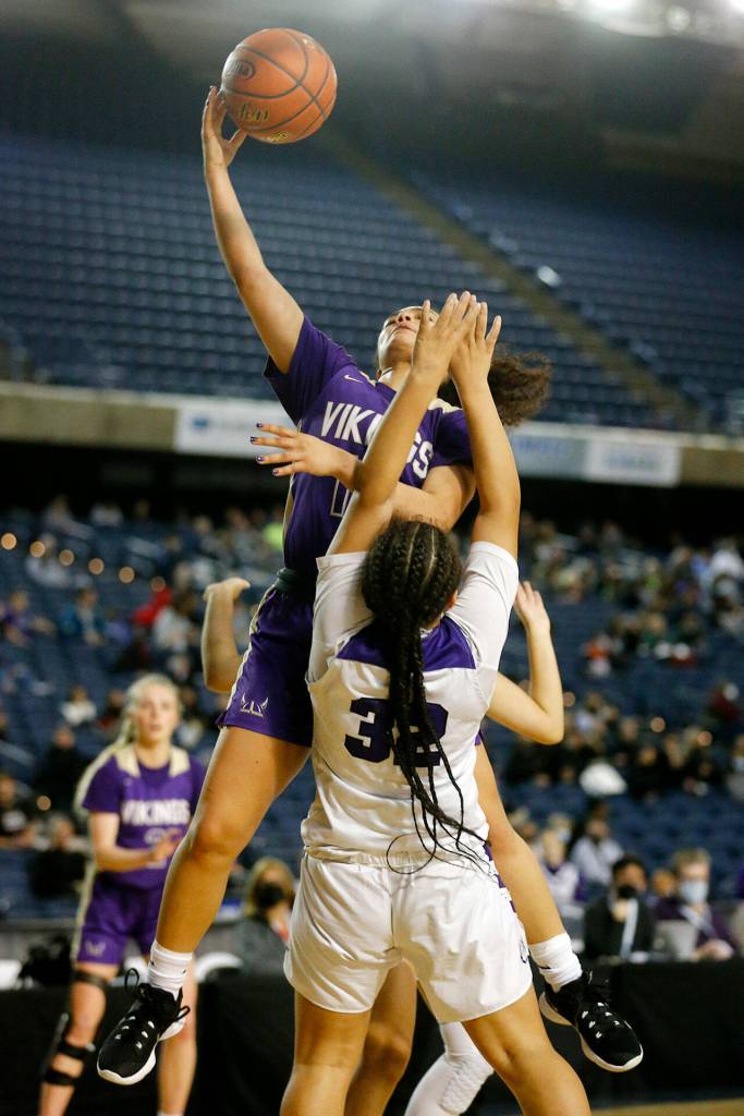 Lake Stevens Baylor Thomas tries to score on a contested layup against Pasco on Thursday at the Tacoma Dome. (Ryan Berry / The Herald)
