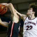 Mountlake Terrace’s Chris Meegan gets blocked by Mt. Spokane’s Andrew Rayment Thursday, March 3, 2022, during a 3A matchup at the Tacoma Dome in Tacoma, Washington. (Ryan Berry / The Herald)