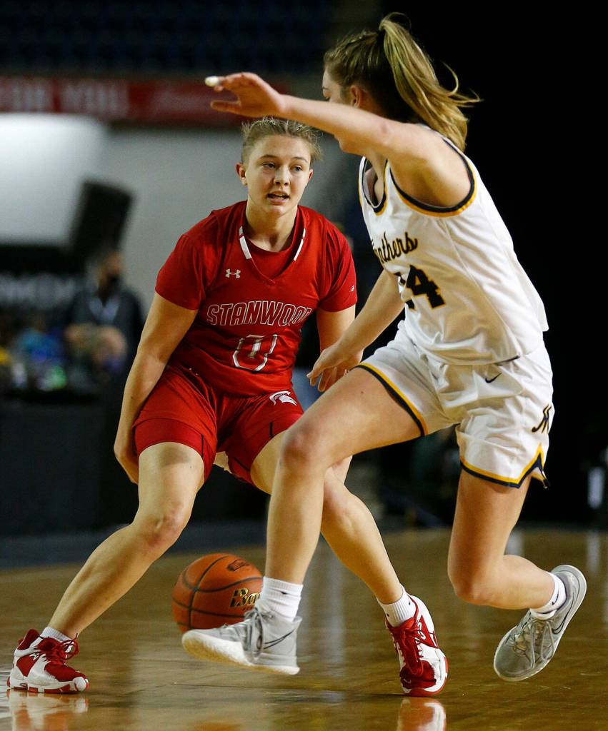 Stanwoods Grace Walker crosses up a defender against Mead on Thursday at the Tacoma Dome. (Ryan Berry / The Herald)