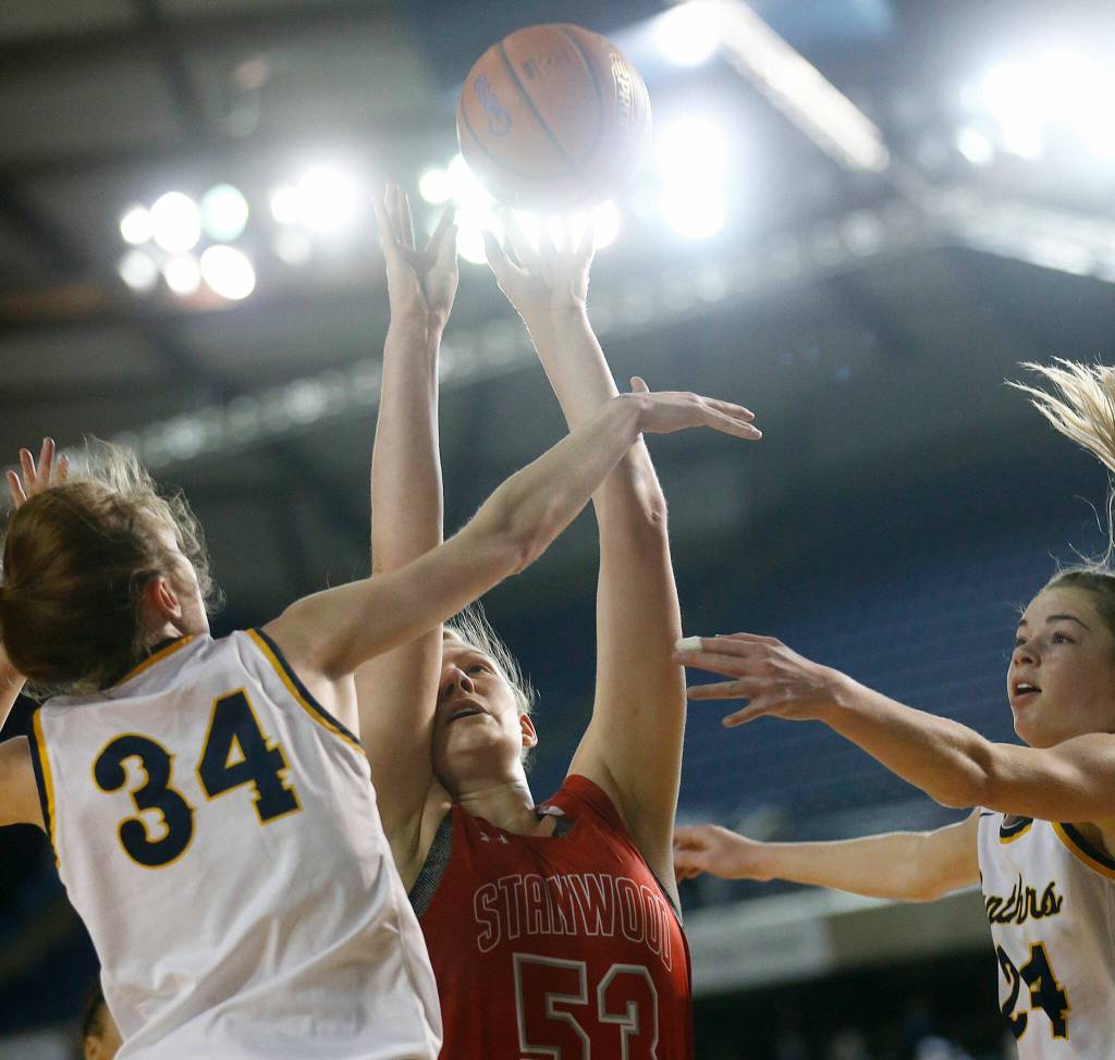 Stanwoods Vivienne Berrett puts the ball up and in for two points against Mead on Thursday at the Tacoma Dome. (Ryan Berry / The Herald)