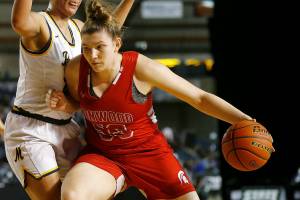 Stanwood’s Vivienne Berrett tries to back down a defender against Mead Thursday, March 3, 2022, during a 3A matchup at the Tacoma Dome in Tacoma, Washington. (Ryan Berry / The Herald)