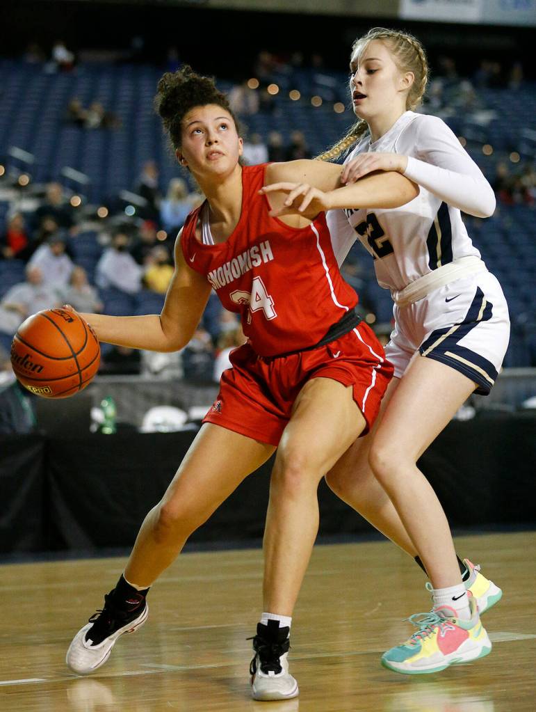 Snohomishs Tyler Gildersleeve-Stiles tries to make space down low against Arlington on Thursday at the Tacoma Dome. (Ryan Berry / The Herald)