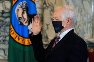 Mike Kreidler is sworn in as insurance commissioner, Wednesday, Jan. 13, 2021, during a ceremony at the Capitol in Olympia, Wash. (AP Photo/Ted S. Warren)