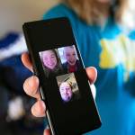 Katie-Jo Page holds up a photo of a recent video chat she, her husband and Mykyta had before the war began, on Sunday in Snohomish. (Ryan Berry / The Herald)