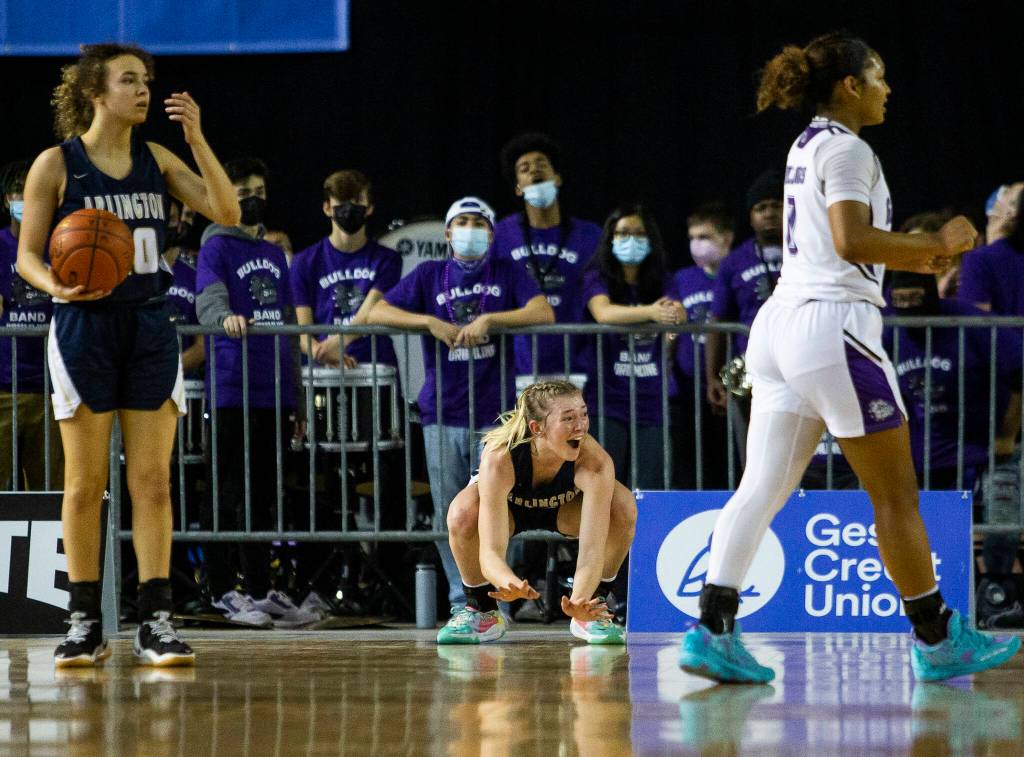 Arlingtons Keira Marsh reacts to a foul called on her during the 3A state semifinal against Garfield at the Tacoma Dome on Friday, March 4, 2022. (Olivia Vanni / The Herald)