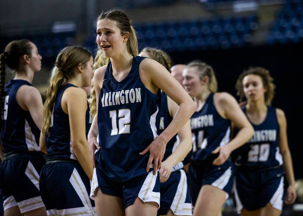 Arlingtons Hannah Rork cries after losing to Garfield in the 3A state semifinal at the Tacoma Dome on Friday, March 4, 2022. (Olivia Vanni / The Herald)