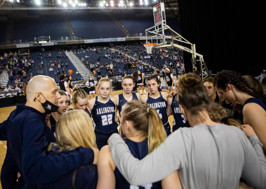 Arlington head coach Joe Marsh talks to his team before the start of the 3A state semifinal against Garfield at the Tacoma Dome on Friday, March 4, 2022. (Olivia Vanni / The Herald)