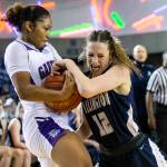 Hannah Rork (right) and Arlington went toe to toe with the unbeaten defending state champions, but Garfield surged ahead in the fourth quarter and pulled away to hand the Eagles a 56-42 loss Friday night in a Class 3A state semifinal in the Tacoma Dome. (Olivia Vanni / The Herald)