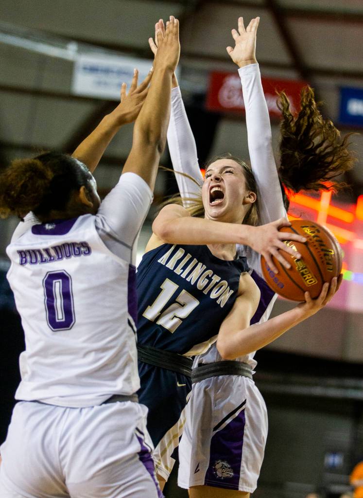Arlington senior Hannah Rork draws a foul while attacking the basket. (Olivia Vanni / The Herald)