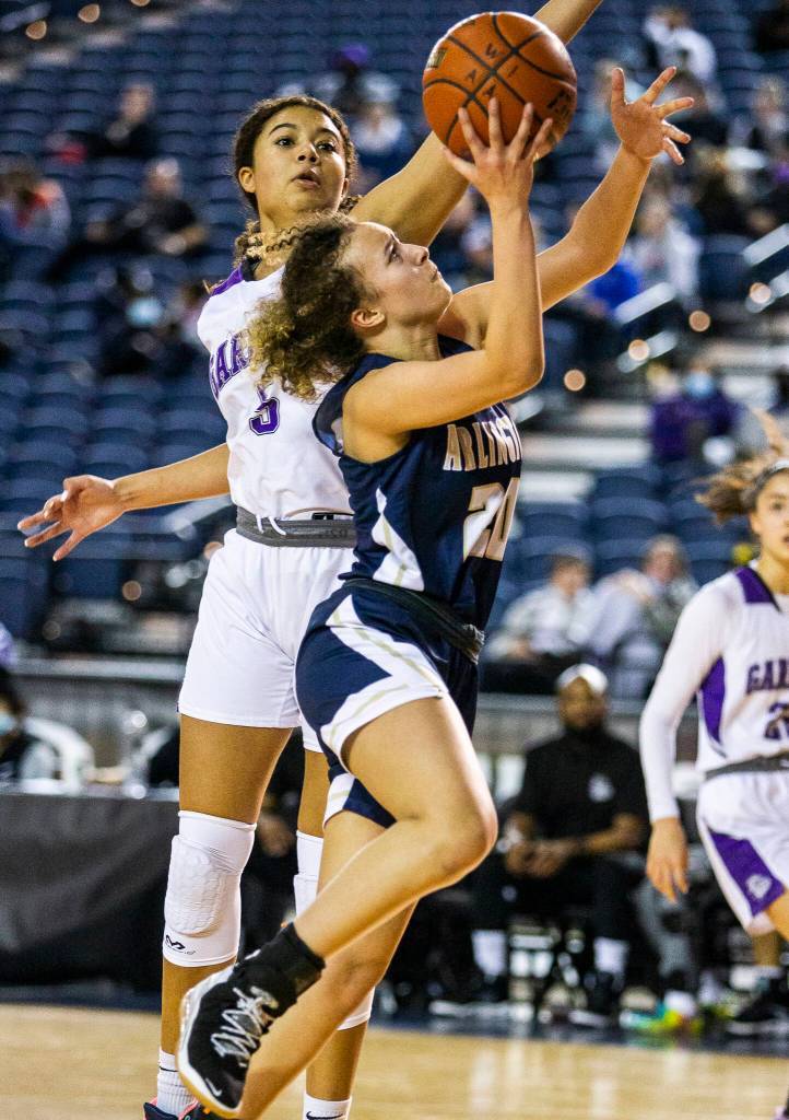 Arlingtons Samara Morrow attempts a layup during the 3A state semifinal against Garfield at the Tacoma Dome on Friday, March 4, 2022. (Olivia Vanni / The Herald)