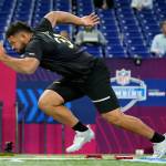 Washington State offensive lineman Abraham Lucas, an Archbishop Murphy alum, runs the 40-yard dash at the NFL scouting combine on Friday in Indianapolis. (AP Photo/Charlie Neibergall)