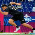 Washington State offensive lineman Abraham Lucas runs the 40-yard dash at the NFL football scouting combine in Indianapolis, Friday, March 4, 2022. (AP Photo/Charlie Neibergall)