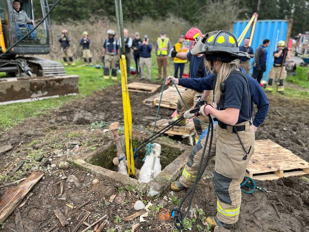 Responders hoist Blaze from the well. (Photo provided)