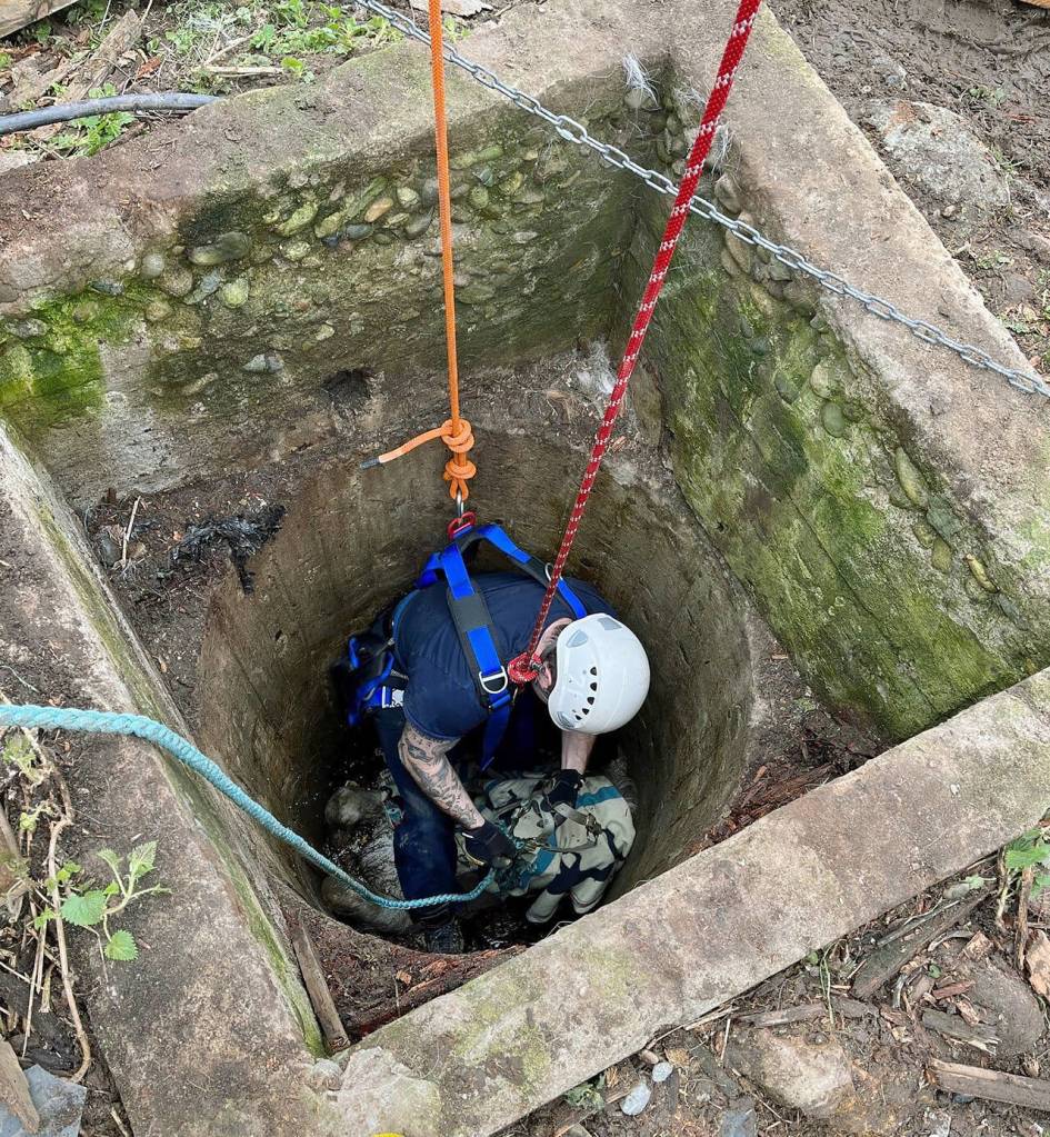 Responders are lowered into the well to sedate Blaze and secure him with straps from extraction. (Photo provided)