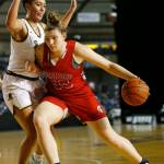 Stanwoods Vivienne Berrett tries to back down a defender during a Class 3A Hardwood Classic game against Mead on March 3 in Tacoma. (Ryan Berry / The Herald)