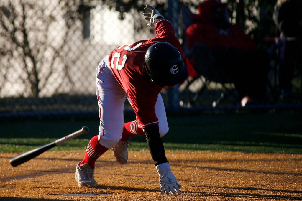Archbishop Murphys Jackson Bonnar stumbles out of the box after putting the ball in play during a jamboree game against Seattle Prep Wednesday, March 9, 2022, in Everett, Washington. (Ryan Berry / The Herald)
