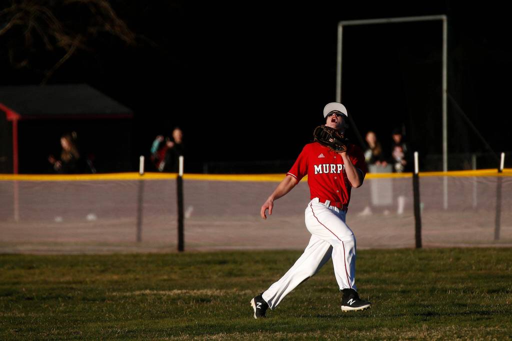 Archbishop Murphys Matt Overholt snags a fly ball before throwing out a runner trying to get back to first during a jamboree game against Seattle Prep Wednesday, March 9, 2022, in Everett, Washington. (Ryan Berry / The Herald)
