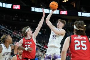 Washington's Cole Bajema (22) shoots against Utah during the second half of an NCAA college basketball game in the first round of the Pac-12 tournament Wednesday, March 9, 2022, in Las Vegas. (AP Photo/John Locher)