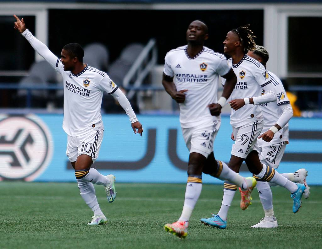 The Los Angeles Galaxy celebrate a goal against Seattle Saturday, March 12, 2022, at Lumen Field in Seattle, Washington. (Ryan Berry / The Herald)
