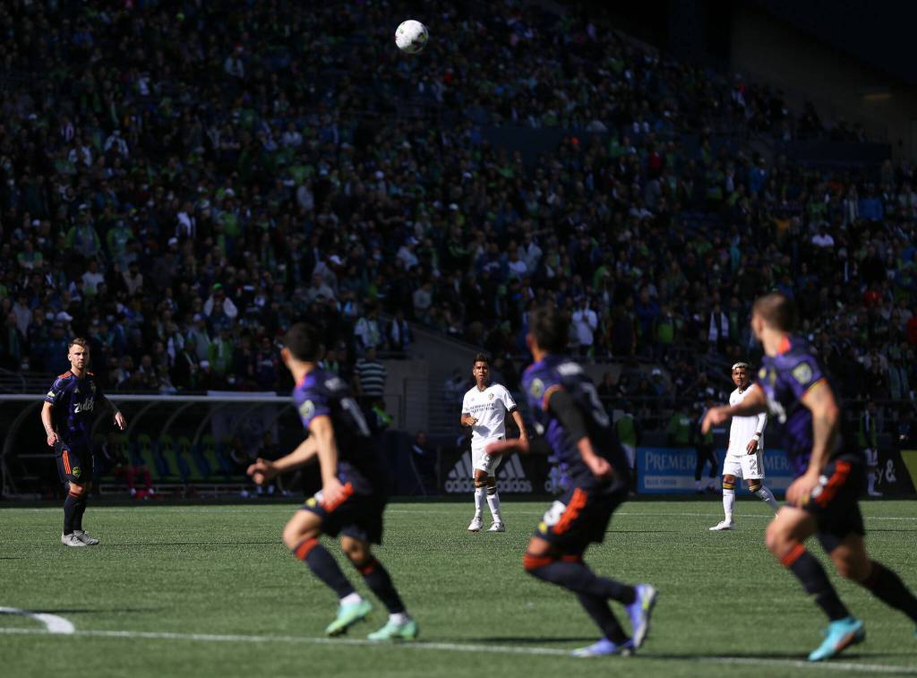 The Seattle Sounders defense tracks a free kick toward their net against the Los Angeles Galaxy Saturday, March 12, 2022, at Lumen Field in Seattle, Washington. (Ryan Berry / The Herald)