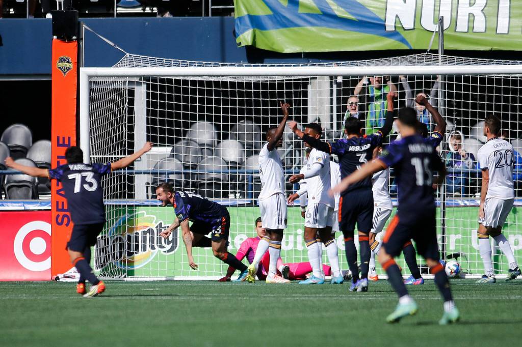 The Seattle Sounders begin to celebrate a goal by Jordan Morris against the Los Angeles Galaxy Saturday, March 12, 2022, at Lumen Field in Seattle, Washington. (Ryan Berry / The Herald)