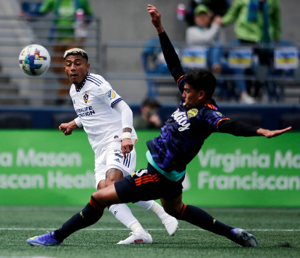 The Seattle Sounders Xavier Arreaga tries to corral a long pass against the Los Angeles Galaxy Saturday, March 12, 2022, at Lumen Field in Seattle, Washington. (Ryan Berry / The Herald)