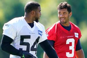 Seattle Seahawks quarterback Russell Wilson (3) walks with linebacker Bobby Wagner (54) after NFL football training camp, Friday, Aug. 14, 2020, in Renton, Wash. (AP Photo/Ted S. Warren)