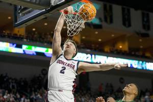 Gonzaga forward Drew Timme (2) shoots against San Francisco forward Patrick Tape (11) during the first half of an NCAA semifinal college basketball game at the West Coast Conference tournament Monday, March 7, 2022, in Las Vegas. (AP Photo/Ellen Schmidt)