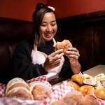 Sreylish Alice Tum, owner of Alices Goodie-Licious, with an assortment of the malasadas and kolaches she makes at Bobbys Hawaiian Style Restaurant in Lynnwood. (Olivia Vanni / The Herald)
