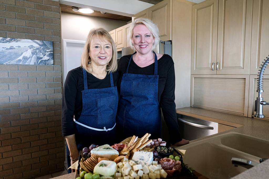 Stephanie Allen and Lindsey Mease are behind Charcuterie by Stephanie, a fast-growing online food business based in Everett. They deliver their bountiful charcuterie boards throughout Snohomish County. (Taylor Goebel / The Herald)
