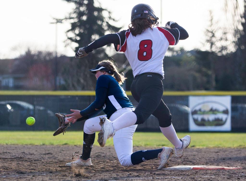 Snohomishs Bridget Johnson leaps to try and beat the ball to first base during the game against Glacier Peak on Wednesday, March 16, 2022 in Snohomish, Washington. (Olivia Vanni / The Herald)