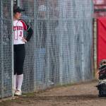 Snohomishs Kendel Sage looks out from the dugout before the start ofvthe game against Glacier Peak on Wednesday, March 16, 2022 in Snohomish, Washington. (Olivia Vanni / The Herald)
