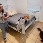 Krystal Guerra, 32, walks inside the apartment which she is packing up to leave, after her new landlord gave her less than a month's notice that her rent would go up by 26%, Saturday, Feb. 12, 2022, in the Coral Way neighborhood of Miami. Guerra, who works in marketing while also pursuing a degree part-time, had already been spending nearly 50% of her monthly income on rent prior to the increase. Unable to afford a comparable apartment in the area as rents throughout the city have risen dramatically, Guerra is putting many of her belongings into storage and moving in with her boyfriend and his daughter for the time being. (AP Photo/Rebecca Blackwell)