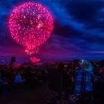 People gather to watch the Thunder on the Bay Fireworks from Legion Memorial Park in 2018 in Everett. (Olivia Vanni / The Herald)
