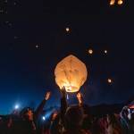 Family members of those lost in the Oso mudslide, along with survivors, release lanterns into the sky at the memorial site on the 8-year anniversary of the mudslide on Tuesday in Oso. (Olivia Vanni / The Herald)