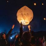 Family members of those lost in the Oso mudslide along with survivors release lanterns into the sky at the memorial site on the 8 year anniversary of the mudslide on Tuesday, March 22, 2022 in Oso, Washington. (Olivia Vanni / The Herald)