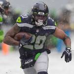 Seattle Seahawks running back Rashaad Penny carries against the Chicago Bears during the second half of an NFL football game, Sunday, Dec. 26, 2021, in Seattle. (AP Photo/Stephen Brashear)